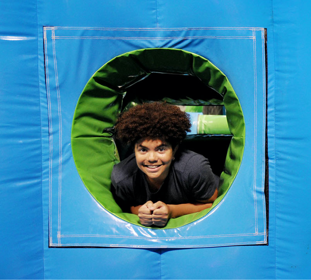 Boy having fun in inflatable park